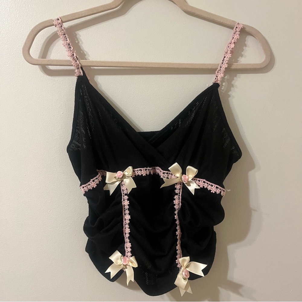 Black and pink tank top with pink bows and flower details